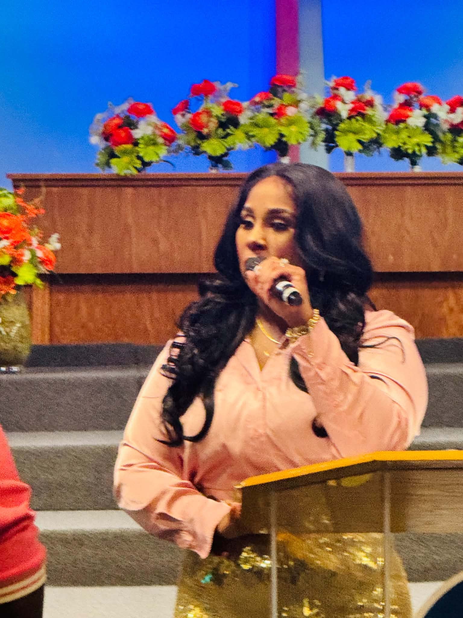Marilyn Brown ministering at the podium